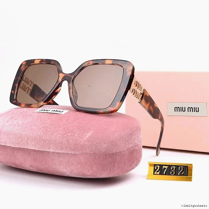 Miu Miu Patterned Oversized sunglasses Black Oval Sunglasses with Polished Detail